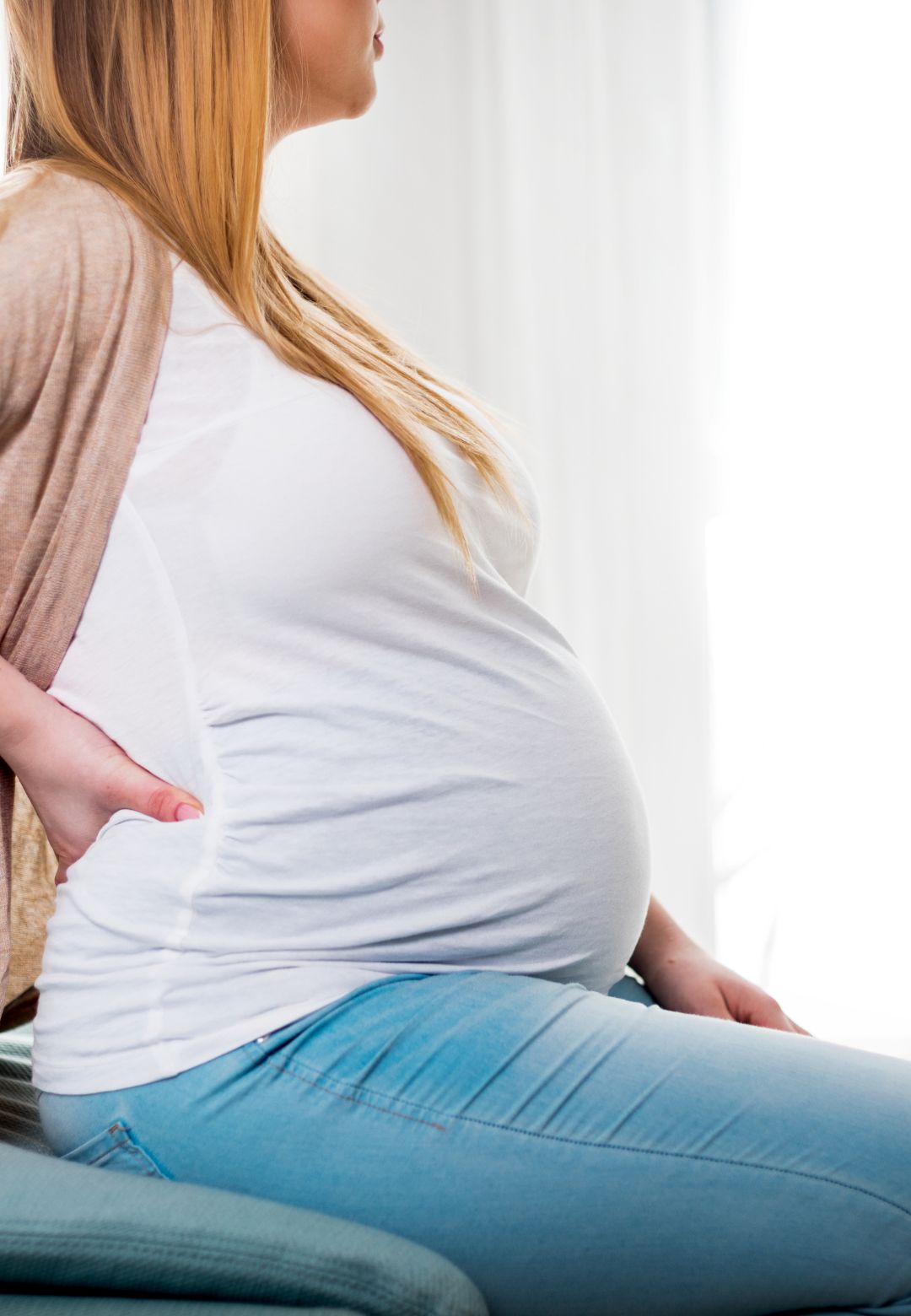 Pregnant woman experiencing back pain
