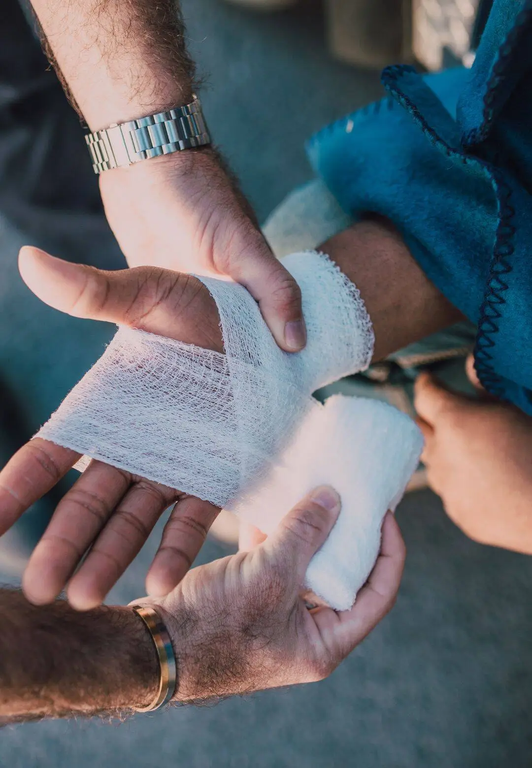 Worker receiving medical treatment for hand injury