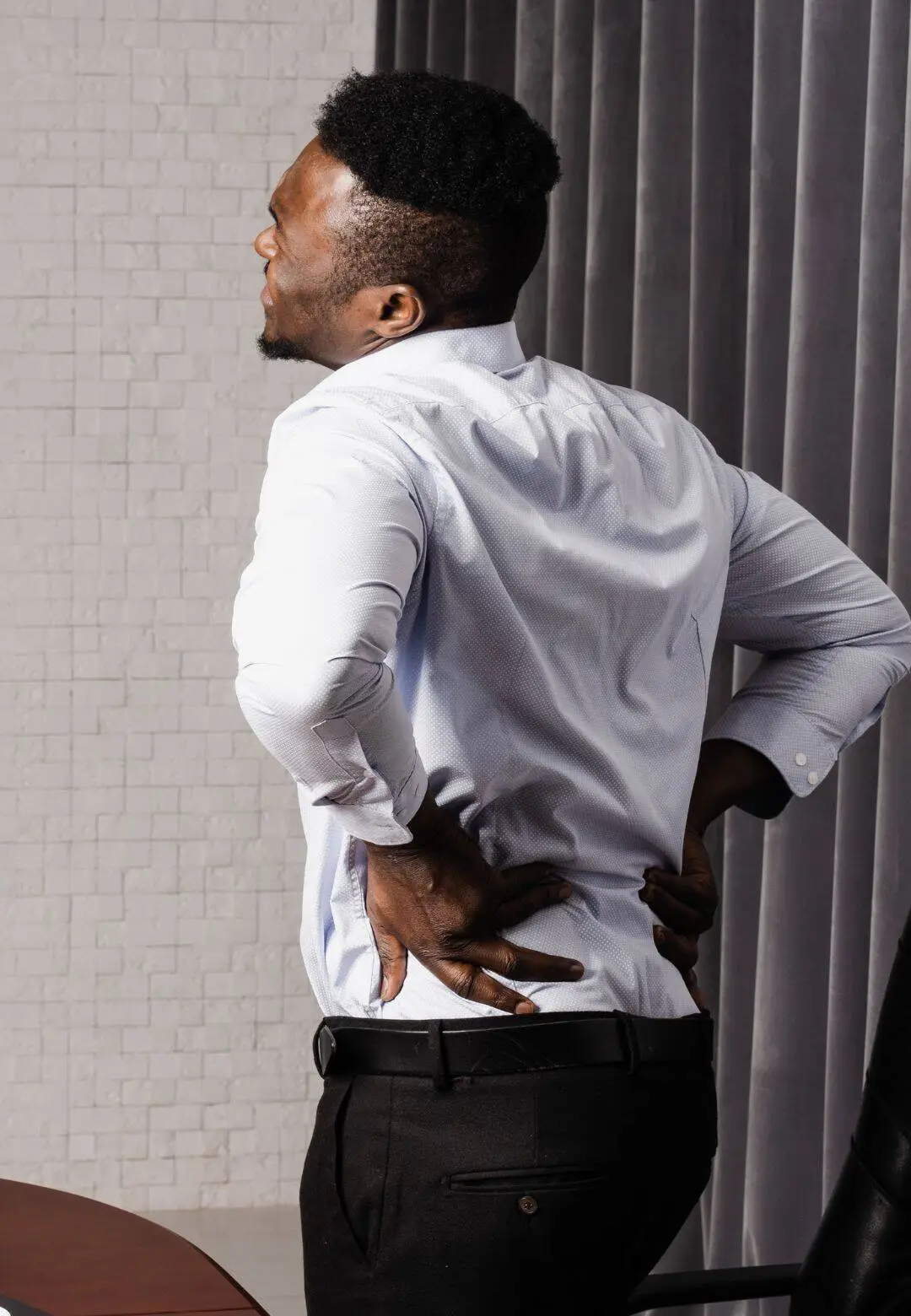 Patient experiencing disc injury symptoms and back pain