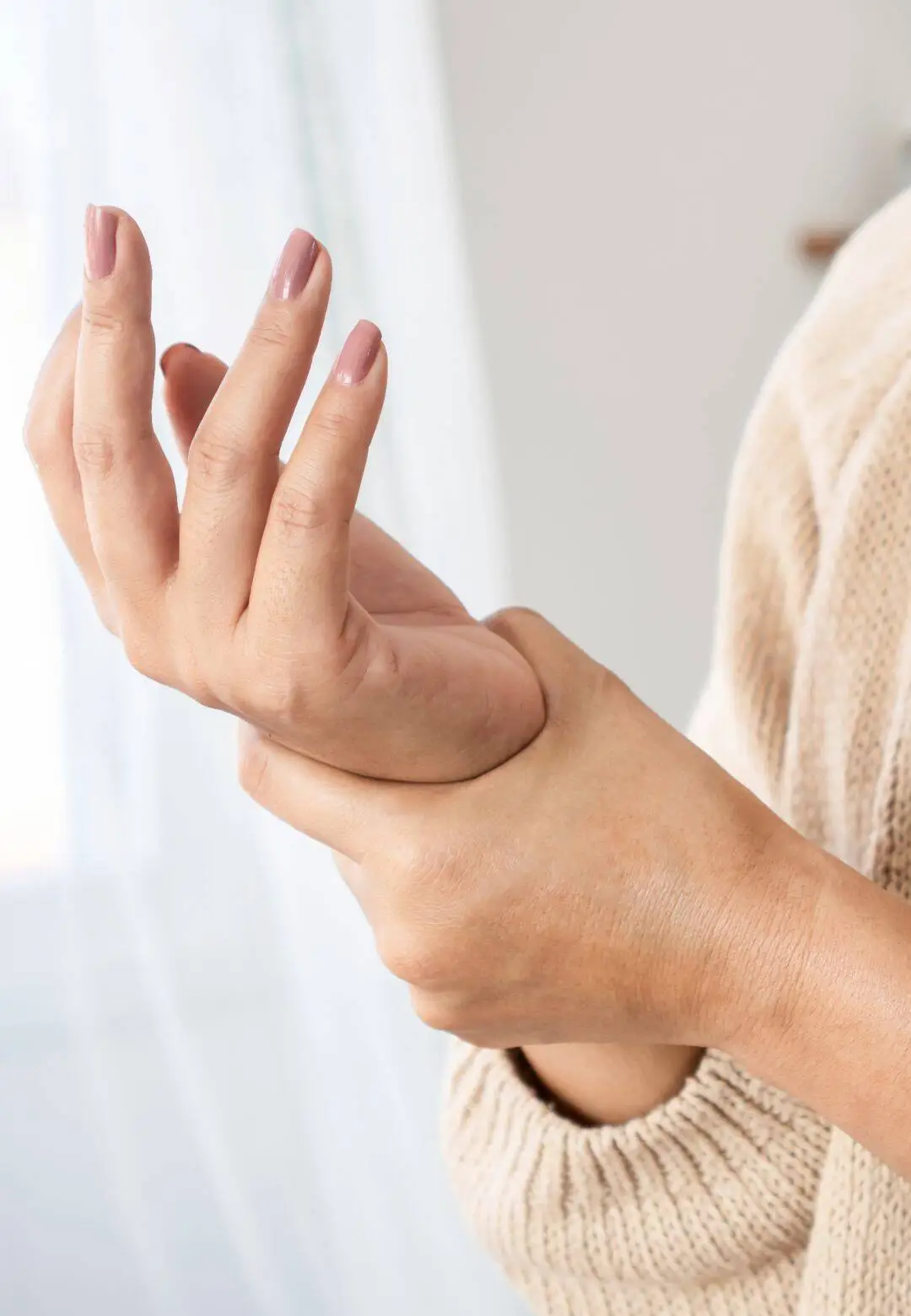 Person experiencing wrist pain from carpal tunnel syndrome