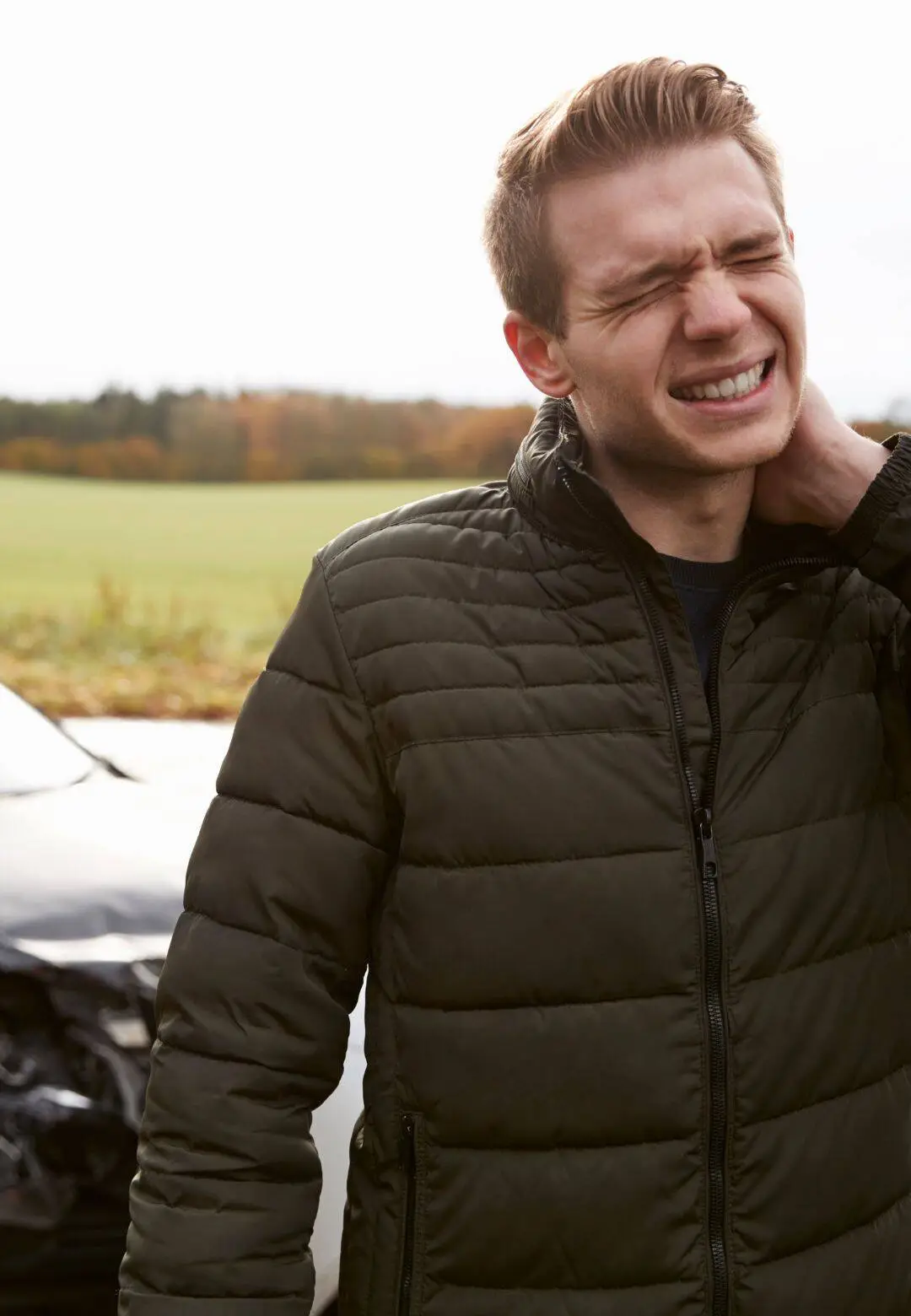 Man experiencing neck pain symptoms