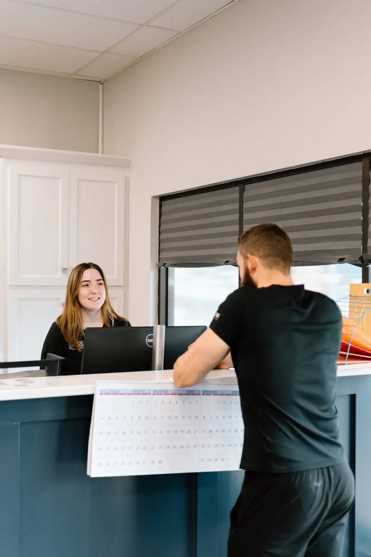 Patient consultation at Meylor Chiropractic front desk