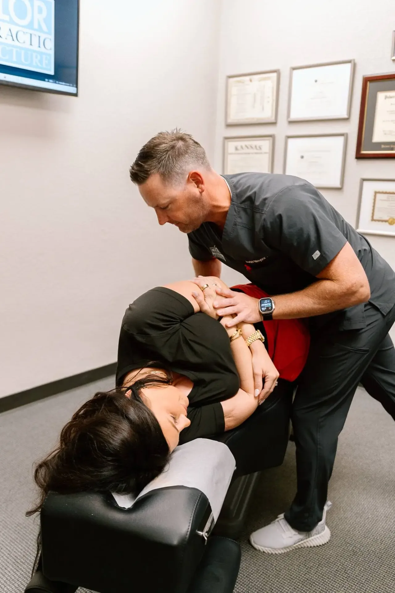 Dr. Meylor providing chiropractic treatment to patient