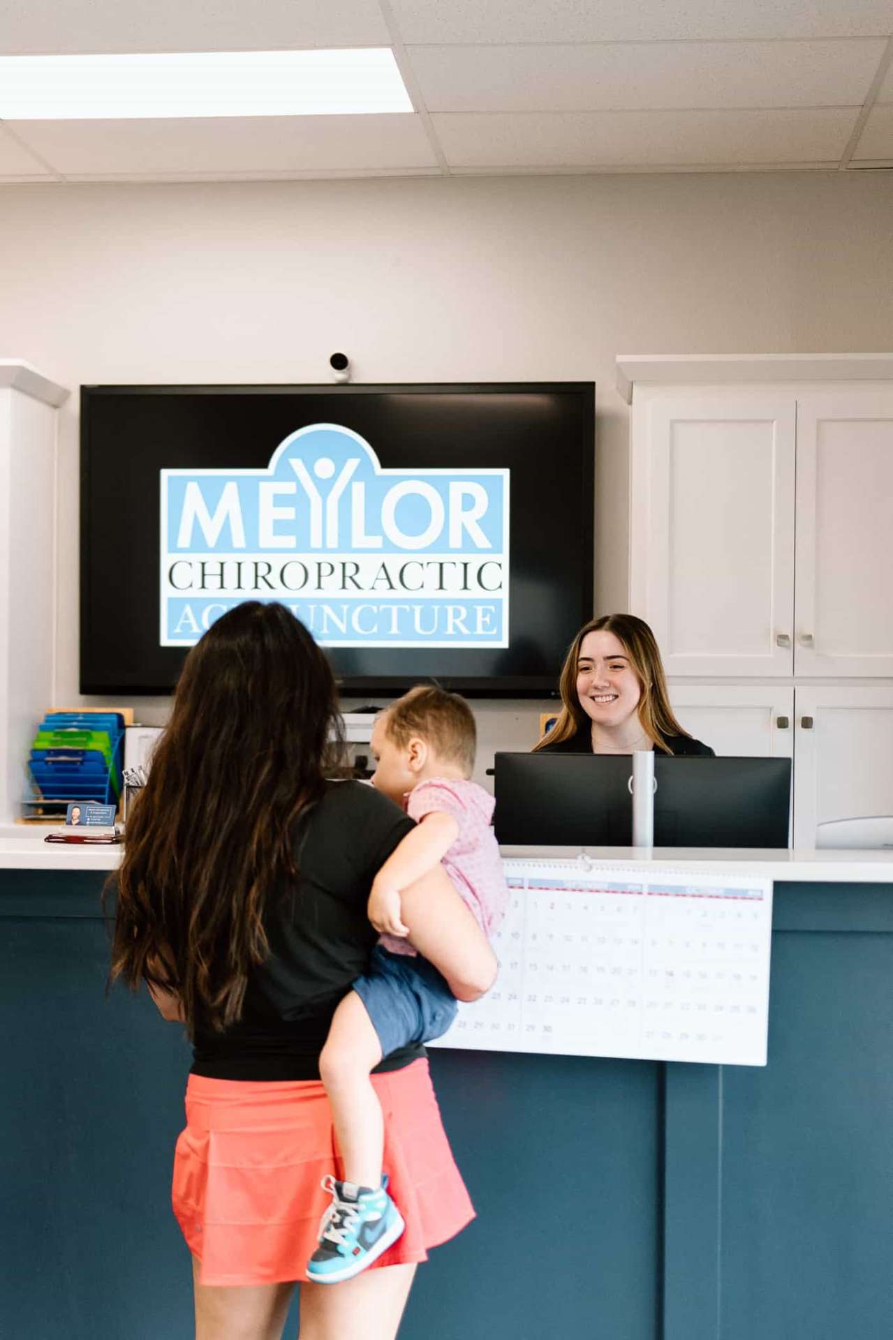 Family receiving chiropractic care