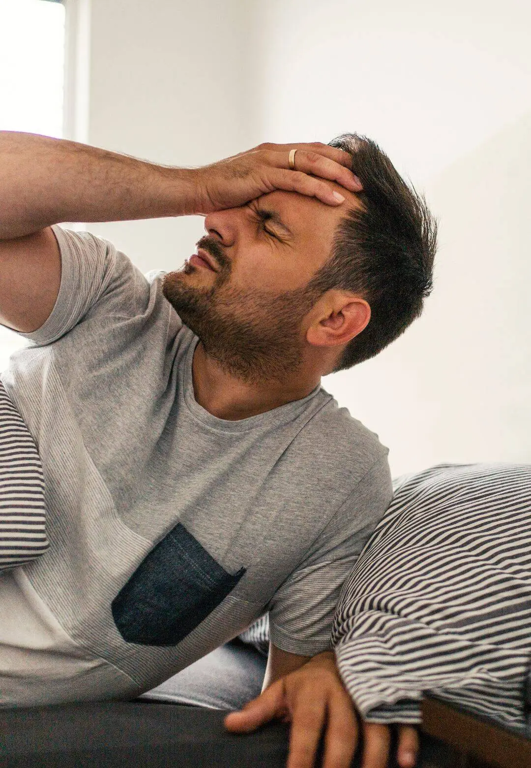 Lenexa patient suffering from chronic headache pain seeking migraine relief treatment